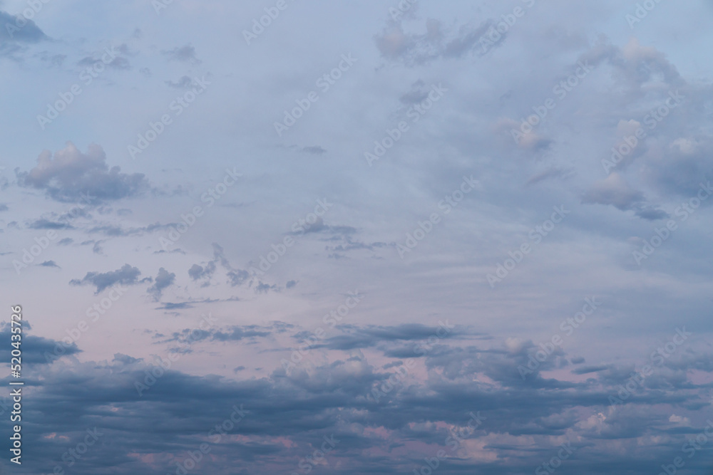 Wall mural beautiful high resolution sunset sky replacement background with a layer of low lying cumulus clouds