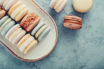 Colorful french macarons on plate