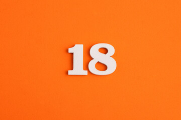 Number 18 - On orange foam rubber background