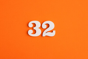 Number 32 - On orange foam rubber background
