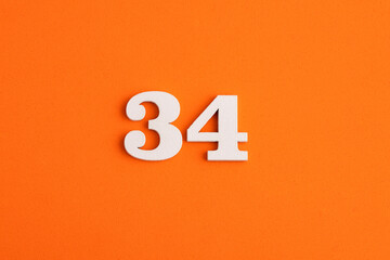 Number 34 - On orange foam rubber background