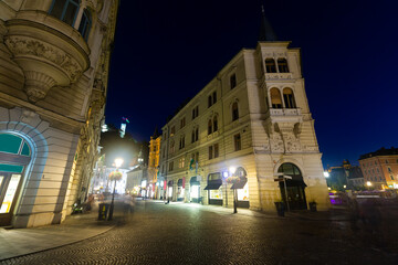 Fototapeta premium Night view of ancient building of Philip Mansion at corner of Cankar Embankment and Stritar Street marking entry into Ljubljana town medieval part, Slovenia