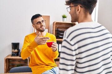 Two man business workers drinking coffee at office