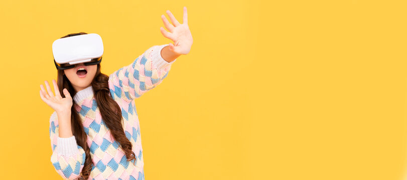 happy teen girl wear vr glasses using future technology for education in virtual reality. Banner of child girl with virtual reality vr headset, studio portrait with copy space.
