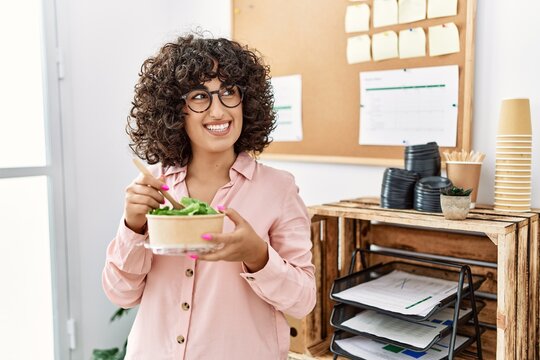 Young Middle East Businesswoman Smiling Happy Eating Salad At The Office.