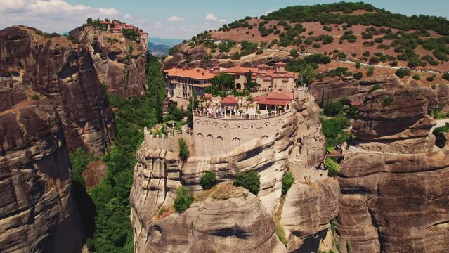 Aerial panorama of famous Meteora monasteries near Kalambaka town. Daytime. Beautiful weather conditions. High quality 4k footage