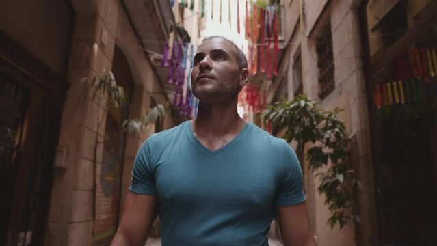 Happy male tourist maps user walking in old town alley an using a map. Barcelona, Spain. Cinematic 4K