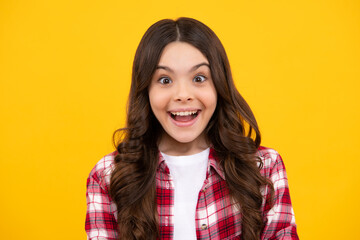 Happy teenager, positive and smiling emotions of teen girl. Emotional portrait of caucasian teenager child girl isolated on studio yellow background.