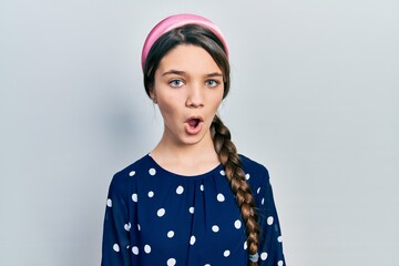 Young brunette girl wearing elegant look afraid and shocked with surprise expression, fear and excited face.