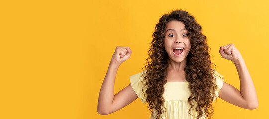 happy kid with long curly hair and perfect skin celebrate success, healthy hair. Child face, horizontal poster, teenager girl isolated portrait, banner with copy space.