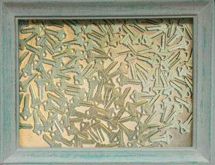 Background of golden keys in an old vintage frame