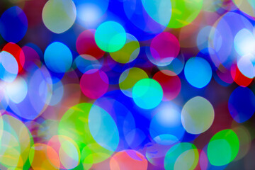Blurred background with colorful bokeh lights. Background blurred Christmas lights