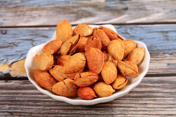 Badam, almonds is on the wooden table