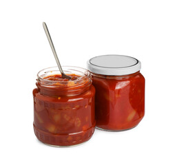 Glass jars of delicious canned lecho on white background