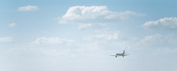 airplane in the sky with landing gear out