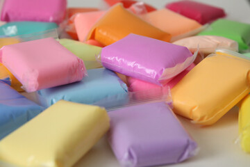 bags with multicolored plasticine are lying
