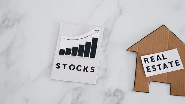 investment opportunities and building wealth, house icon next to stock market stats symbol of alternative financial choices