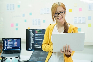 Close up programmer is coding and programming software.