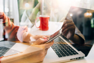 Businessman and team analyzing financial statement Finance task. with smart phone and laptop and tablet. Wealth management concept