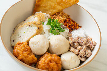 spicy small flat rice noodles with fish balls and shrimp balls without soup