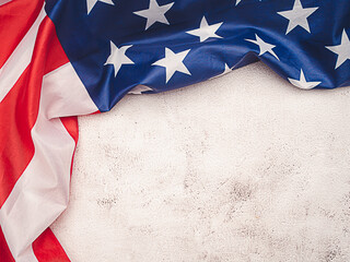 American flag on a cement background with copy space for text