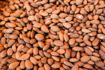 Lots of shelled almond nuts on a farmer's market stall
