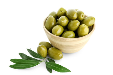 Bowl of tasty green olives and leaves isolated on white background