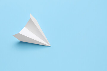 Paper plane on blue background