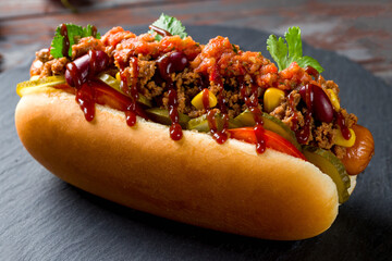 hot dog Mexican with jalapeno, corn and meat, chili con carne macro close up