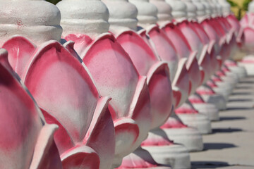 Pink lotus flowers stucco patterns. Traditional Thai style lotus stucco in Thai temple.