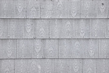 Old asbestos shingle siding on a house background