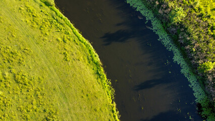 river flowing through the field shooting from a drone ukraine