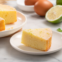 Delicious Lemon Glazed Pound Sponge cake on white marble table background.