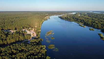 the Dnieper river flows among the forests and fields, ukraine filming from a drone. view from above