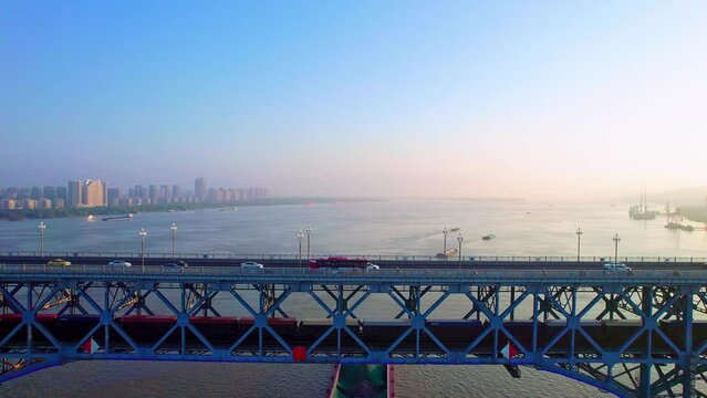 Follow-up photography of trains and ships traveling on the Nanjing Yangtze River Bridge in Jiangsu, China