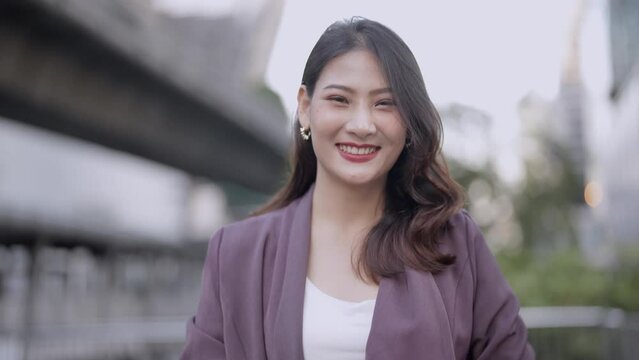 Young beautiful Business Asian woman talking and interviewing herself. Worker walking with feeling happy and successful.