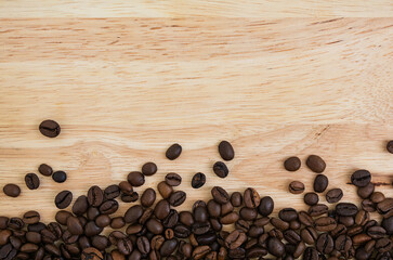 Mixture of different kinds of coffee beans on wooden background. Coffee background