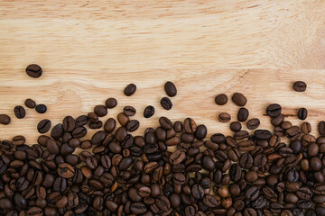 Mixture of different kinds of coffee beans on wooden background. Coffee background