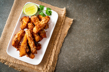 Fried Snapper Belly on white plate