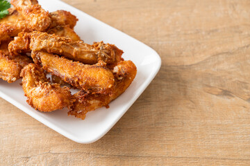 Fried Snapper Belly on white plate