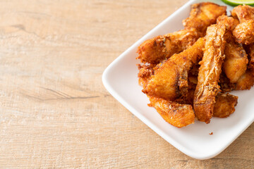 Fried Snapper Belly on white plate