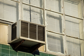 Fototapeta premium Old air conditioner unit in building window 