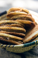 Delicious coconut cookies filled with caramel inside a wicker basket at a picnic