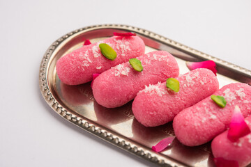 Pink Chumchum or rose flavoured chum chum or cham cham, indian and pakistani sweet