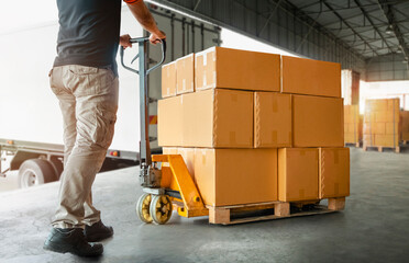 Workers Unloading Packaging Boxes on Pallet in Warehouse. Loading Cartons, Cardboard Boxes. Shipping Warehouse. Shipment Boxes. Storehouse. Cargo Supplies Warehouse Logistics.	