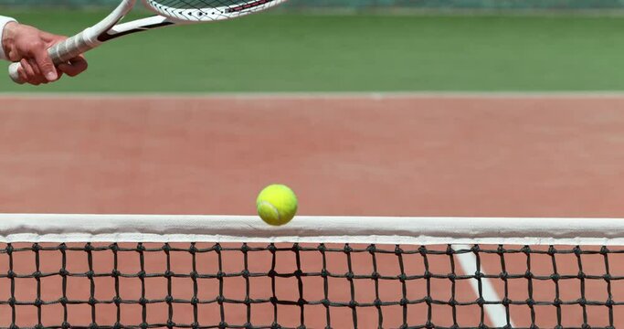 Super slow motion of tennis player hitting the ball. Close-up of forehand hit. Filmed on high speed cinema camera, 1000fps.