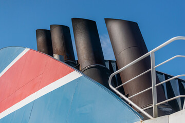 Ship chimneys on blue sky background. Phot from the ferry on Baltic Sea.