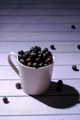 a glass of blackcurrant, delicious fresh berries that contain a lot of vitamins 