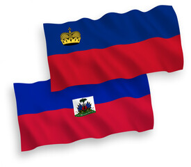 National vector fabric wave flags of Liechtenstein and Republic of Haiti isolated on white background. 1 to 2 proportion.