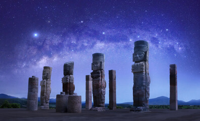 Toltec sculptures in Tula against background of starry sky, Mexico - obrazy, fototapety, plakaty